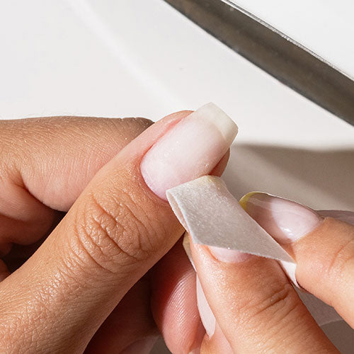 Prepping nails before gel nail polish application - photographed in New Zealand on model